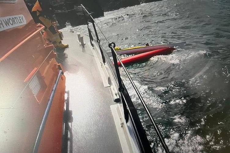 With the strong wind forcing the kayakers towards shore, the coxswain manoeuvred the lifeboat to keep away from the rocks whilst the volunteer crew assisted all four casualties onto the lifeboat.