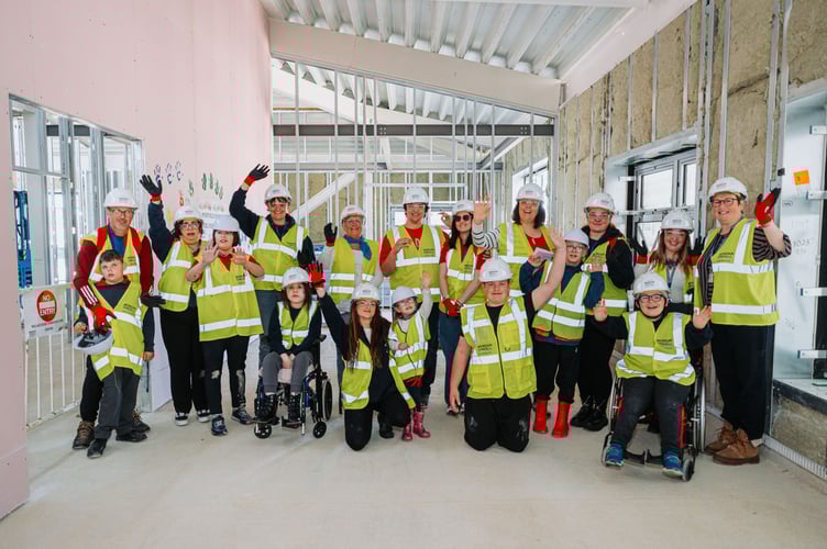 Pupils from Portfield School attended a 'topping-out' ceremony, leaving their handprints on the new building to symbolise their role in the school's future.
