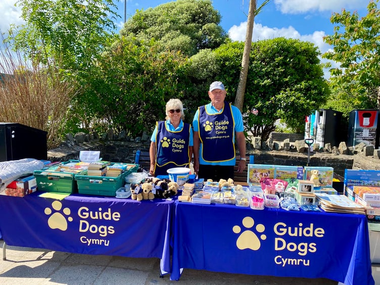 Pic: Volunteers Helen and Tony Hedley at the Guide Dogs stall in Saundersfoot Harbour