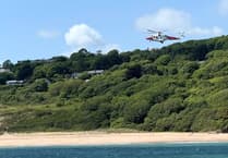 Tenby lifeboats and rescue helicopter save paddleboarders from rocky predicament
