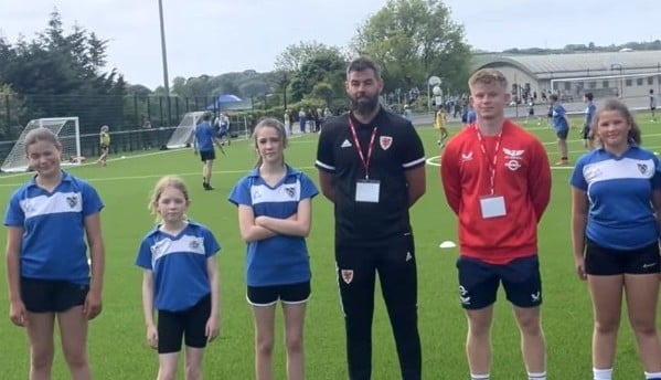 Welsh football star Joe Ledley, alongside former pupil Archie Hughes, celebrated the opening of a new 3G football pitch at Tenby's Ysgol Greenhill, marking a significant upgrade supported by a £407,000 grant.