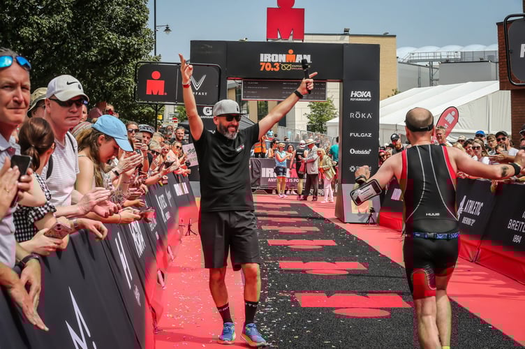 The Ironman Wales community is saddened by the passing of announcer Jay Luke, who was a cherished presence at the Tenby finish line, celebrated for his humour and support.
