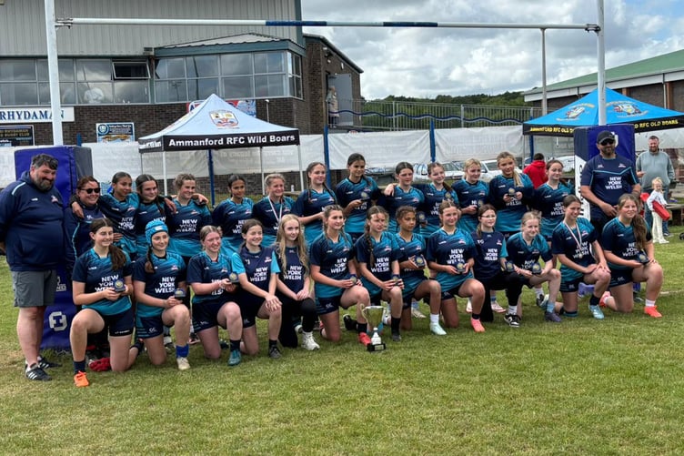The South Pembs Sharks and coaches with their trophy