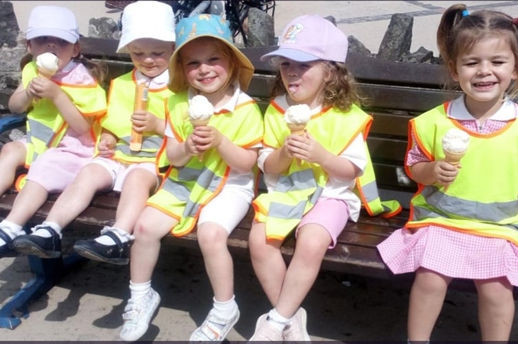 Participants in the Saundersfoot Playgroup and Daycare Sponsored Toddle enjoying a well-deserved ice cream, kindly donated by Dan Ellison from The Mermaid Gift Shop.