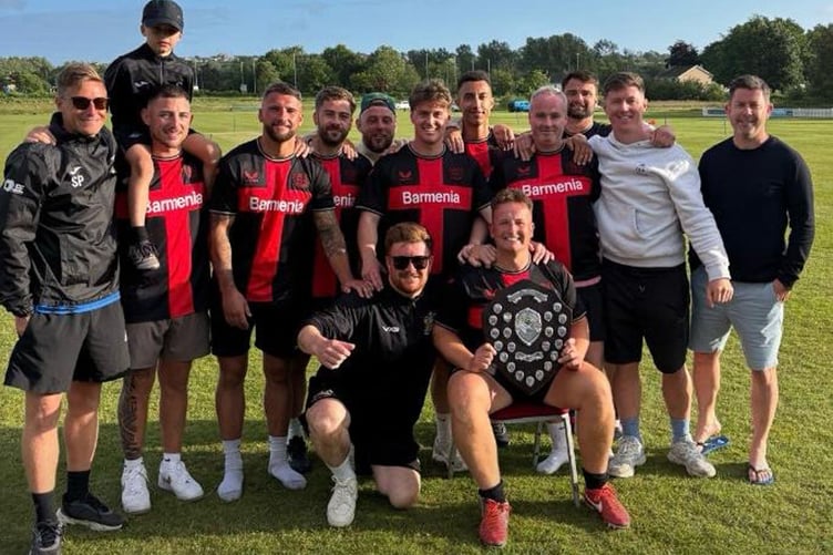 Bayerneverlosen celebrate with the trophy after losing four previous finals