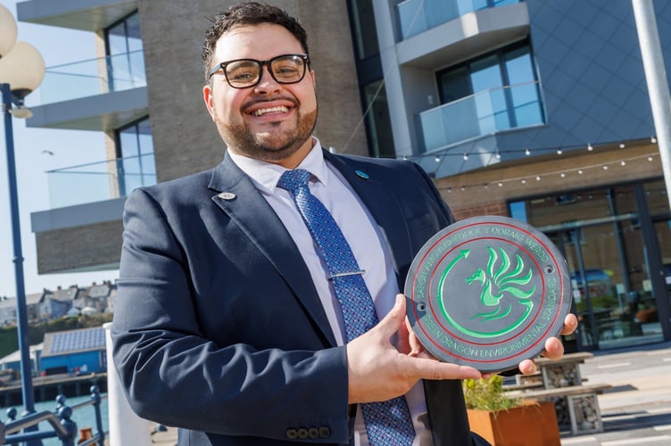 Tŷ Hotel Milford Waterfront Manager Mathew Verallo is pictured with the Green Dragon Level 4 Environmental Standard