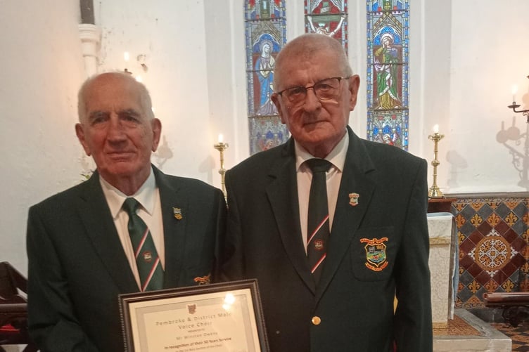 Winston Owens (left), chorister for 50 years, with Pembroke and District Male Voice Chairman Huw Morgan.