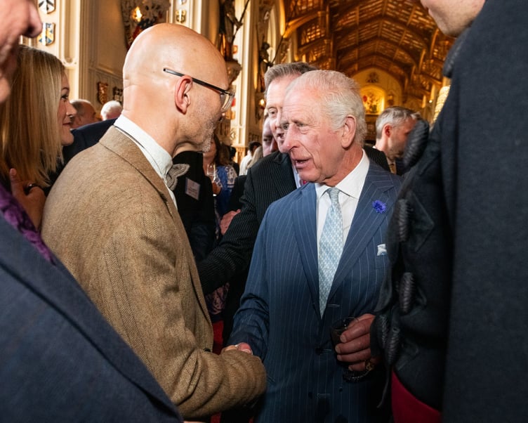 King Charles III congratulates Bluestone National Park Resort’s representative, Marten Lewis, Bluestone’s director of sustainability, at reception for The King’s Awards for Enterprise recipients in Windsor Castle, June 2025.