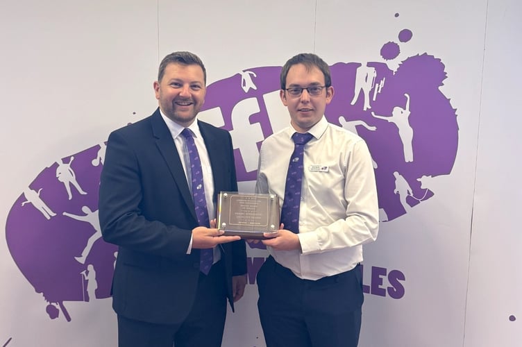 Samuel Kurtz MS with Wales YFC chairman Dewi Davies and the Bronze Quality Mark for Youth Work.