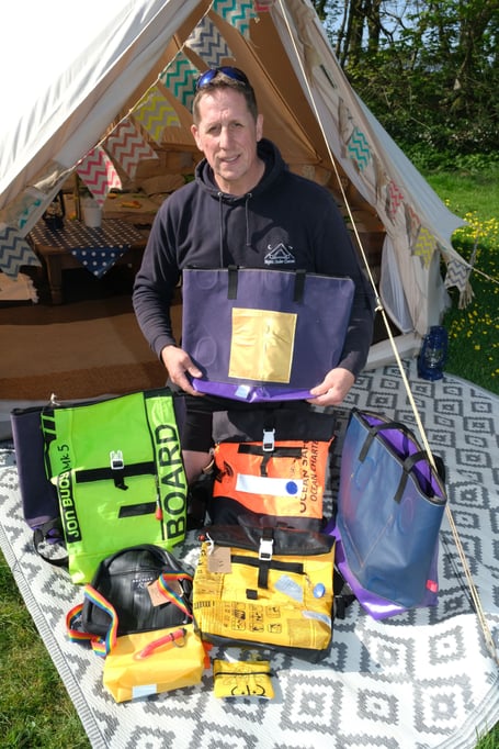 Nights Under Canvas collaborates with Ecoast to upcycle damaged airbeds, creating sustainable merchandise and promoting environmental initiatives with Business Wales.
