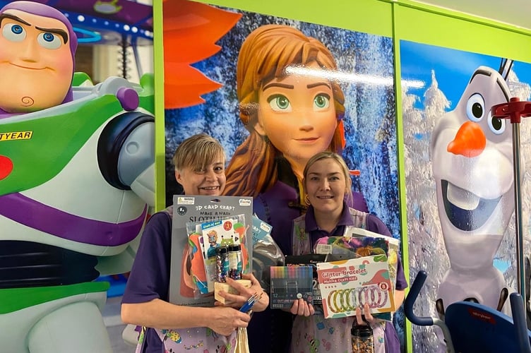 Pictured above: Staff from Cilgerran Ward with the play resources
