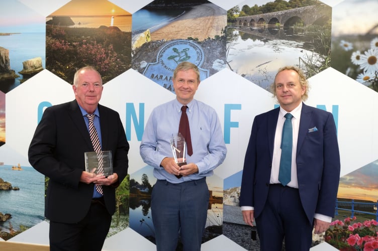 Caption: Celebrating the two awards for Ysgol Gymraeg Bro Penfro are, left to right, Council Leader Cllr Jon Harvey, Headteacher Dafydd Hughes and Steven Richards-Downes, Director for Education. 