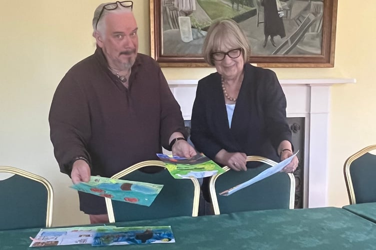 Andrew Douglas-Forbes with Volunteer, Carol Pugh, judging the art and poetry competition