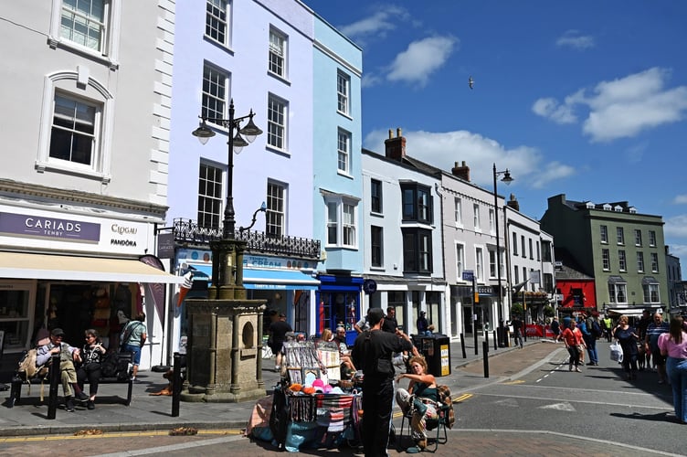 Tenby Town Council is considering introducing priority seating in Tudor Square to aid the elderly and those with mobility issues, ensuring they have better access to seating in the town centre.