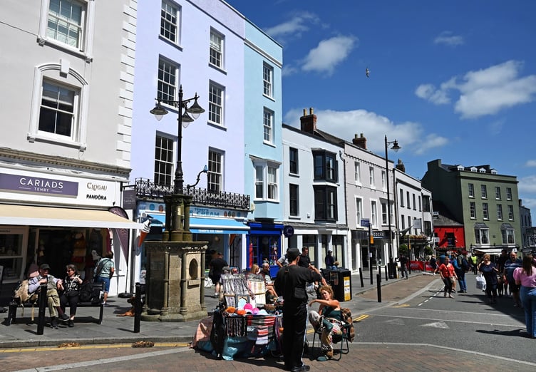 Tenby Town Council is considering introducing priority seating in Tudor Square to aid the elderly and those with mobility issues, ensuring they have better access to seating in the town centre.