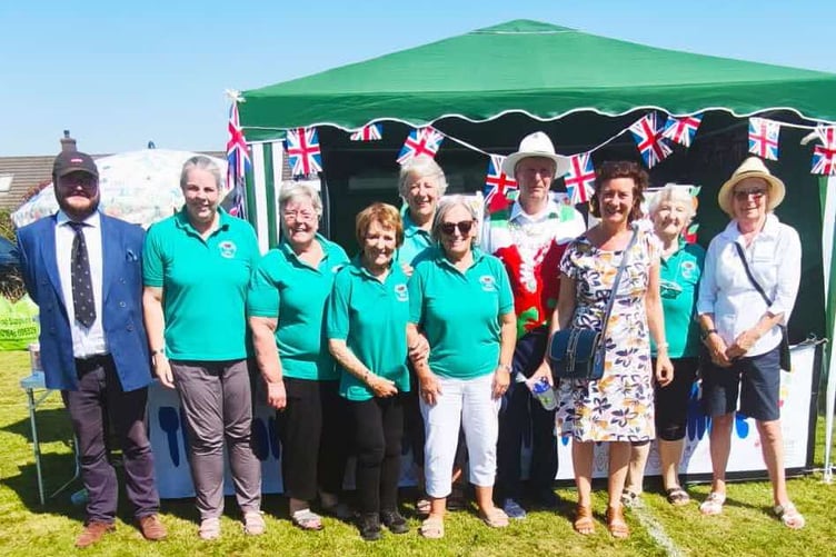 Neyland Ladies Choir Carnival stall with Eluned Morgan