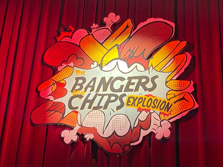 The Bangers and Chips Explosion - logo on Torch Theatre curtains