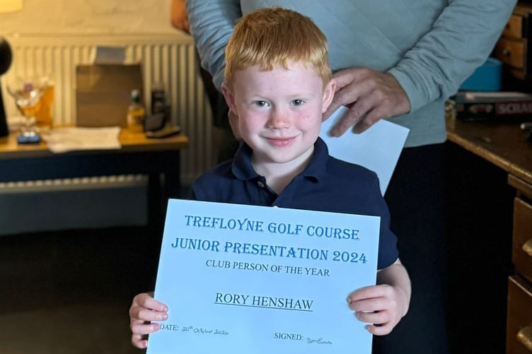Rory Henshaw receiving the club person of the year award in 2024
