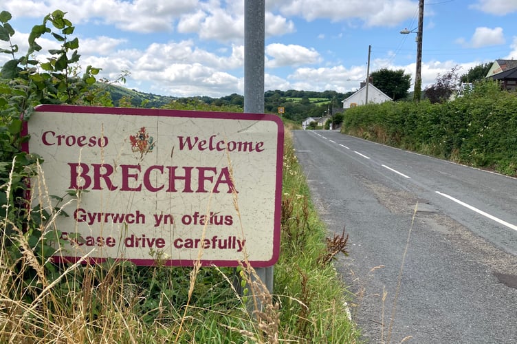 Residents of a Carmarthenshire village have expressed varied opinions on the proposed state-backed wind farm in Brechfa forest.