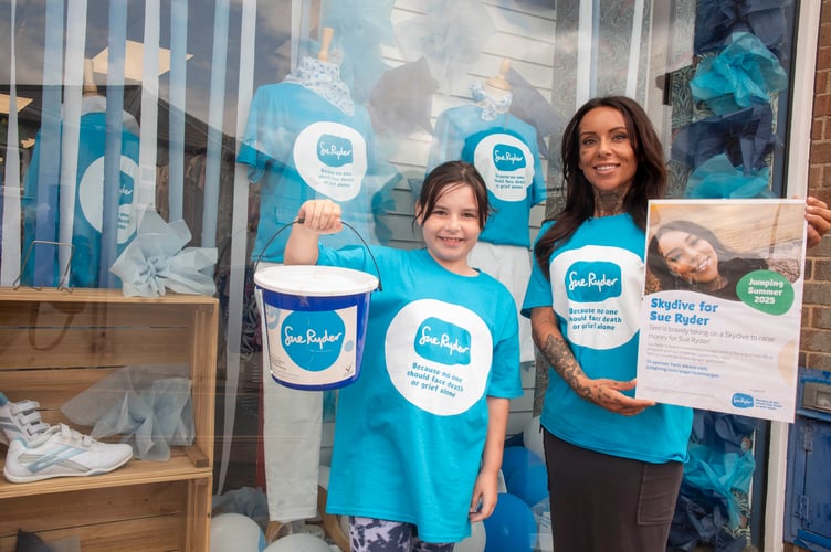 Terri Morgan with daughter Becca outside the Sue Ryder shop in Cinderford, Gloucestershire.