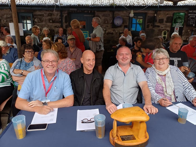 Mike May (far left) with the three other judges