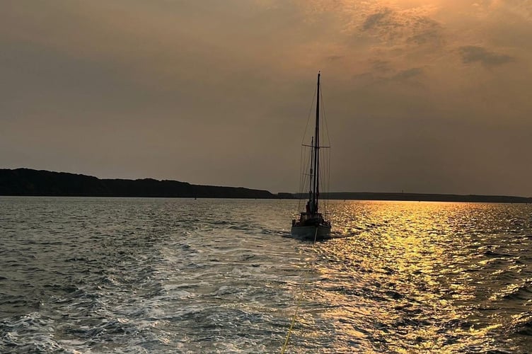 Angle RNLI's crew spent nine hours at sea assisting a yacht skipper with severe chest pains.