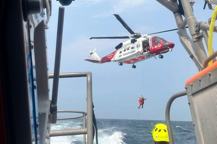 Angle RNLI's crew spent nine hours at sea assisting a yacht skipper with severe chest pains.