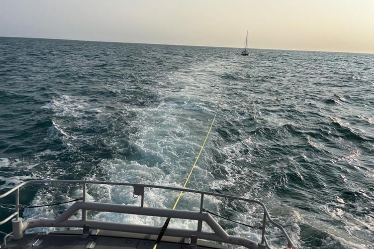 Catamaran under tow to Fishguard harbour