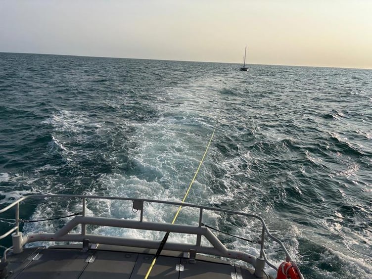 Catamaran under tow to Fishguard harbour