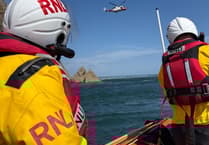 Woman rescued after being trapped on rocks at Giltar Point