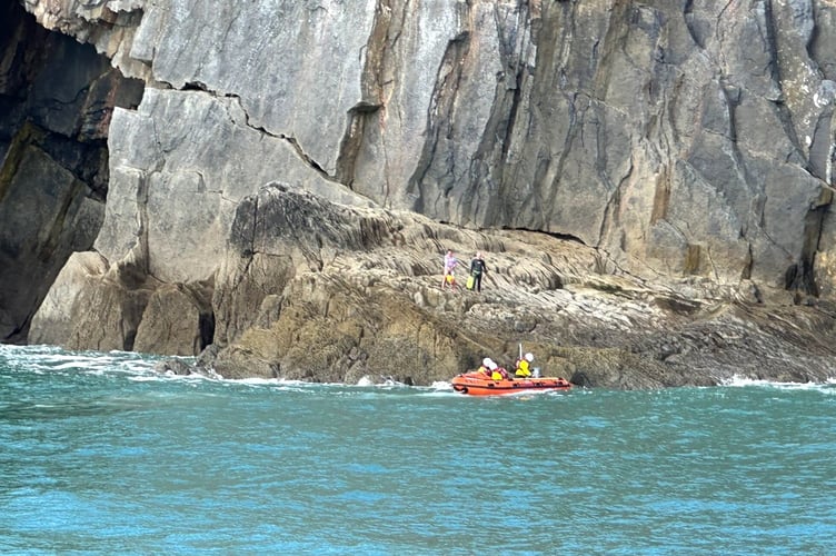 Tenby RNLI's all-weather lifeboat was launched to assist two swimmers found stranded on rocks near Skrinkle.
