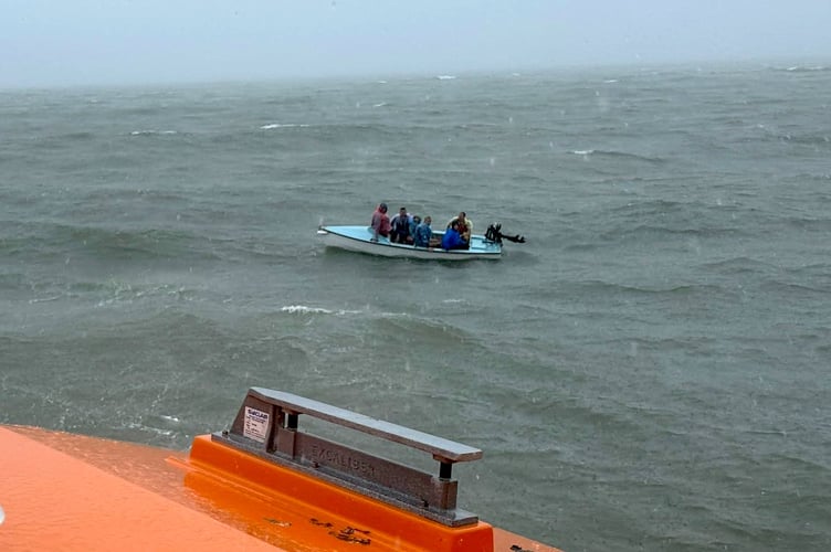 Tenby RNLI's lifeboat rescued six people from a 14ft vessel caught in rough seas off Amroth. After the vessel ran out of fuel, the crew towed it to safety.