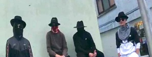 Dyfed-Powys Police and Crimestoppers seek public assistance to identify individuals in connection to a burglary in Carmarthen, offering a £1,000 reward for information leading to arrests and convictions.