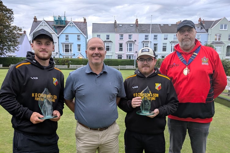 Valero Pairs winners Corey Davies and Nathan Rees with their trophies alongside Hywel Gibbs (Valero) and Tenby Bowling Club President Andrew Muskett.