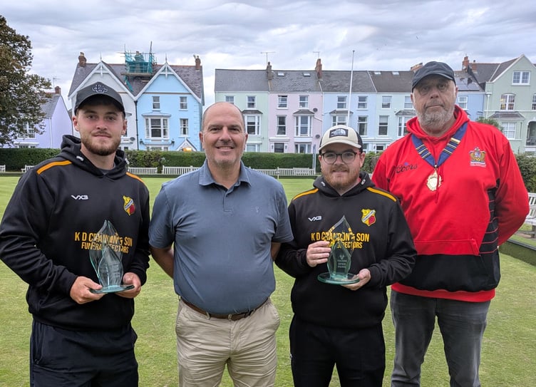 Valero Pairs winners Corey Davies and Nathan Rees with their trophies alongside Hywel Gibbs (Valero) and Tenby Bowling Club President Andrew Muskett.