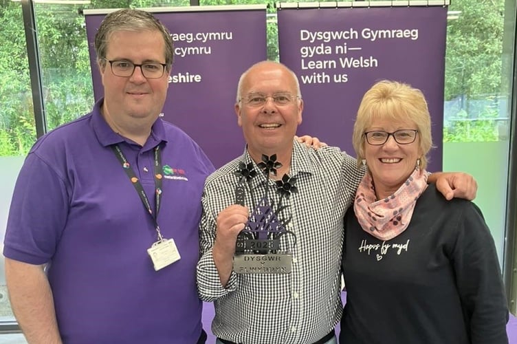 Kevin Davies with his tutor Buddug Harries and Rhidian Evans, Chief Officer of Menter Iaith Sir Benfro. 