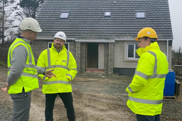 Senedd Member Samuel Kurtz pictured meeting house builders in Pembrokeshire.