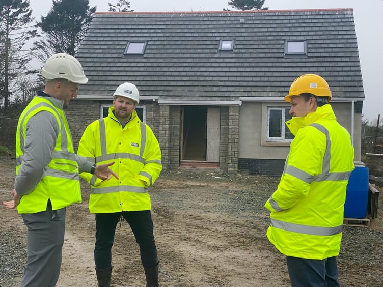 Senedd Member Samuel Kurtz pictured meeting house builders in Pembrokeshire.