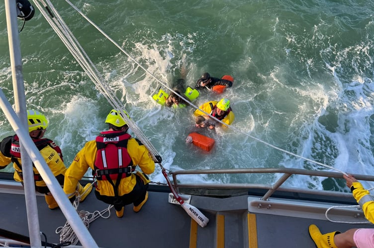 Two crew members immediately entered the water to assist with the extraction of the casualties, only one of which was wearing a lifejacket, with the others clinging to a petrol tank.