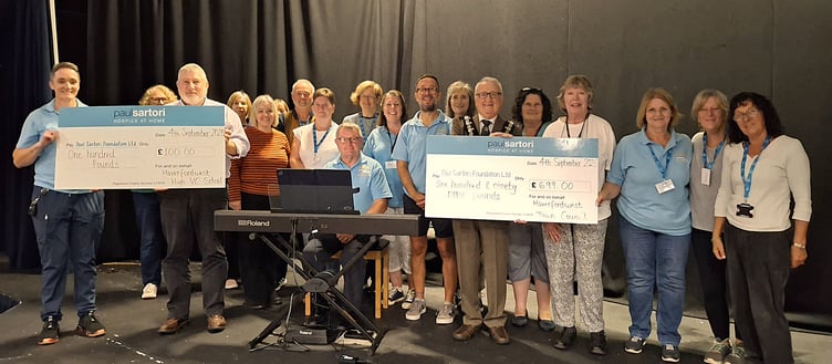 Councillor Roy Thomas, Mayor of Haverfordwest (centre); Reg White Community Liaison Lead at Haverfordwest High VC School (left); Amanda Elmes and Judith Williams Choir Coordinators along with Mark Heron Musical Director of Paul Sartori Community Choir and Peter Griffiths Accompanist (at the new digital piano). Also pictured are several of the Paul Sartori Community Choir members.