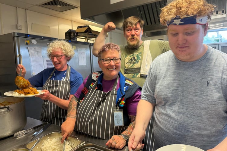 The VC Gallery kitchen volunteers serving the community meal