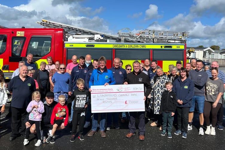 A holiday park event in memory of Christine Bowen garnered £21,000 for Wales Air Ambulance, Crymych Fire Station, and Glangwili Intensive Care Unit.
