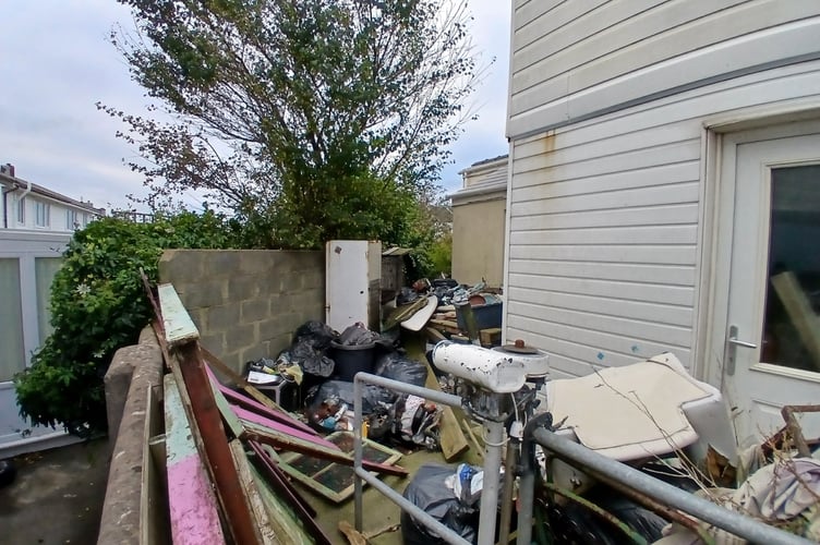 A Milford Haven man who has repeatedly refused to clear piles of waste from his home has admitted breaching a court order. 