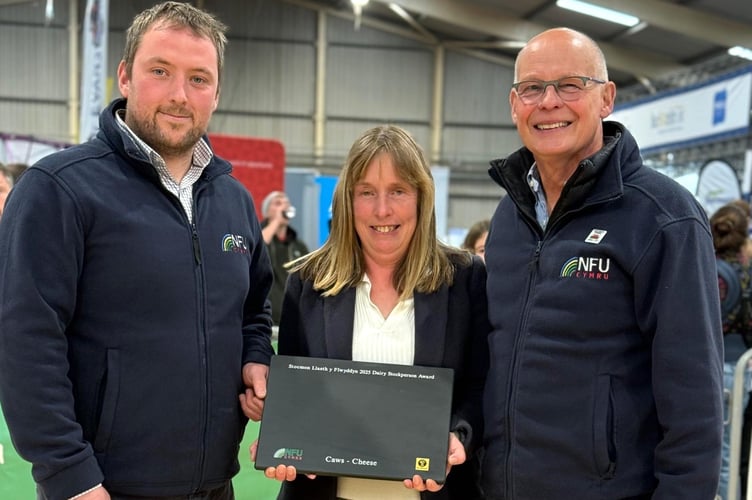 Notes to Editors: Pictured is NFU Cymru Dairy Board Chairman Jonathan Wilkinson, NFU Cymru / NFU Mutual Dairy Stockperson of the Year Award winner for 2025, Kathryn Joules and NFU Cymru / NFU Mutual Group Secretary, Rhys Williams