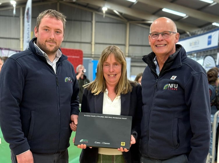 Notes to Editors: Pictured is NFU Cymru Dairy Board Chairman Jonathan Wilkinson, NFU Cymru / NFU Mutual Dairy Stockperson of the Year Award winner for 2025, Kathryn Joules and NFU Cymru / NFU Mutual Group Secretary, Rhys Williams
