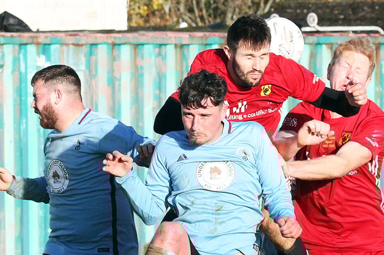 An aerial challenge during Carew's 1-1 draw against Pennar Robins