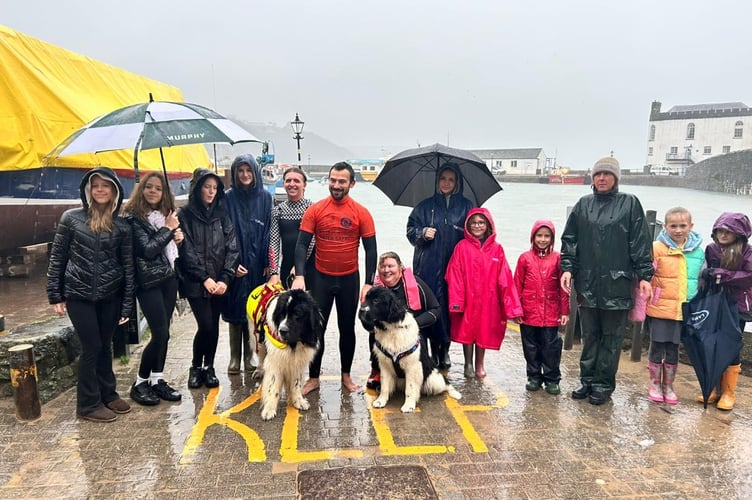 Junior members of Tenby Surf Lifesaving Club were treated to a demonstration of the work of Newfoundland water rescue dogs Bandit (5 years old) and Tahoe (18 months old) hosted by the local lifesaving club at the resorts harbour beach on 4th November 2025.