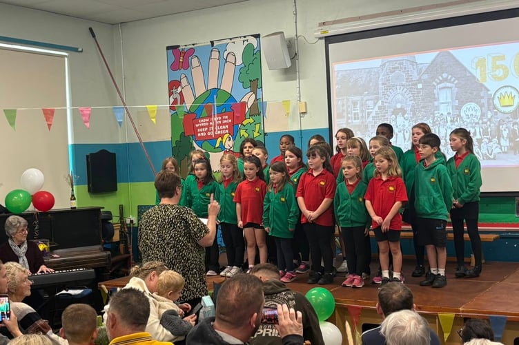 Children singing at the 150th anniversary celebrations