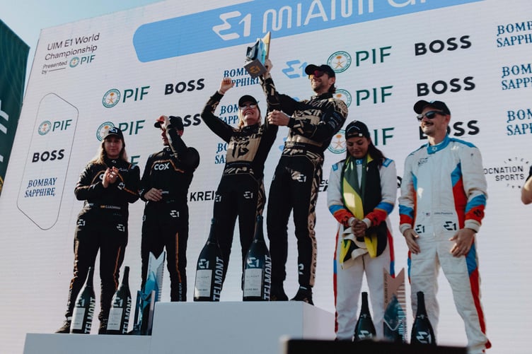 Sam Coleman and Emma Kimiläinen on the podium