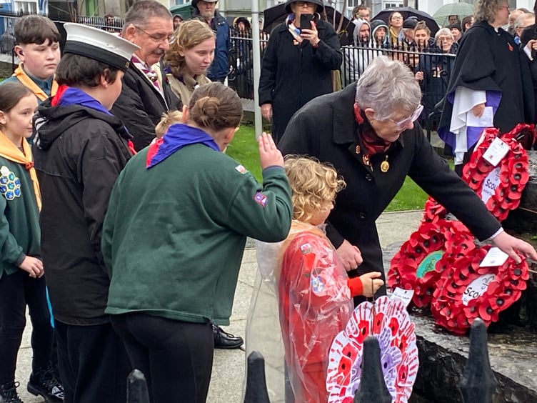 Scouts, Sea Scouts and Girl Guiding representatives laying wreaths at Pembroke Dock